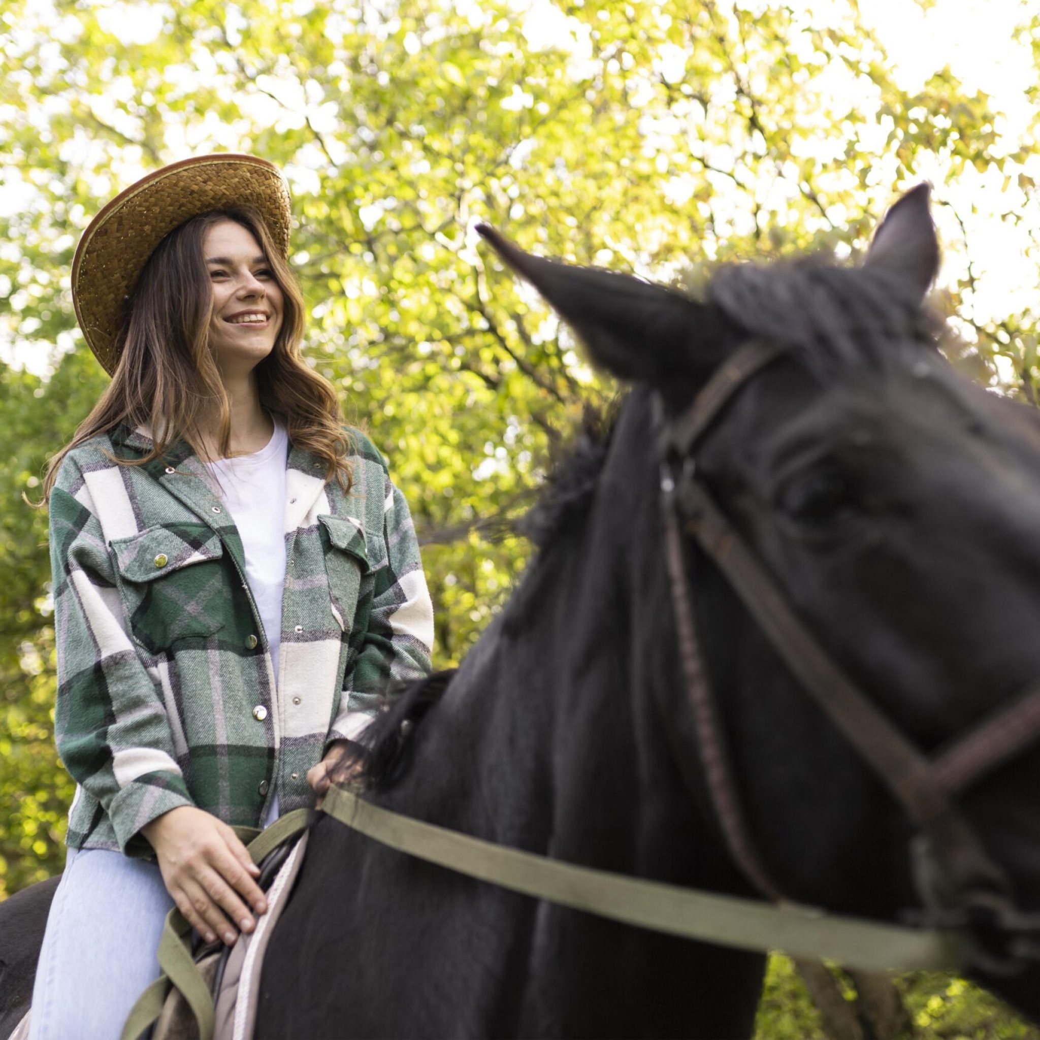 happy-woman-riding-horse-outdoors